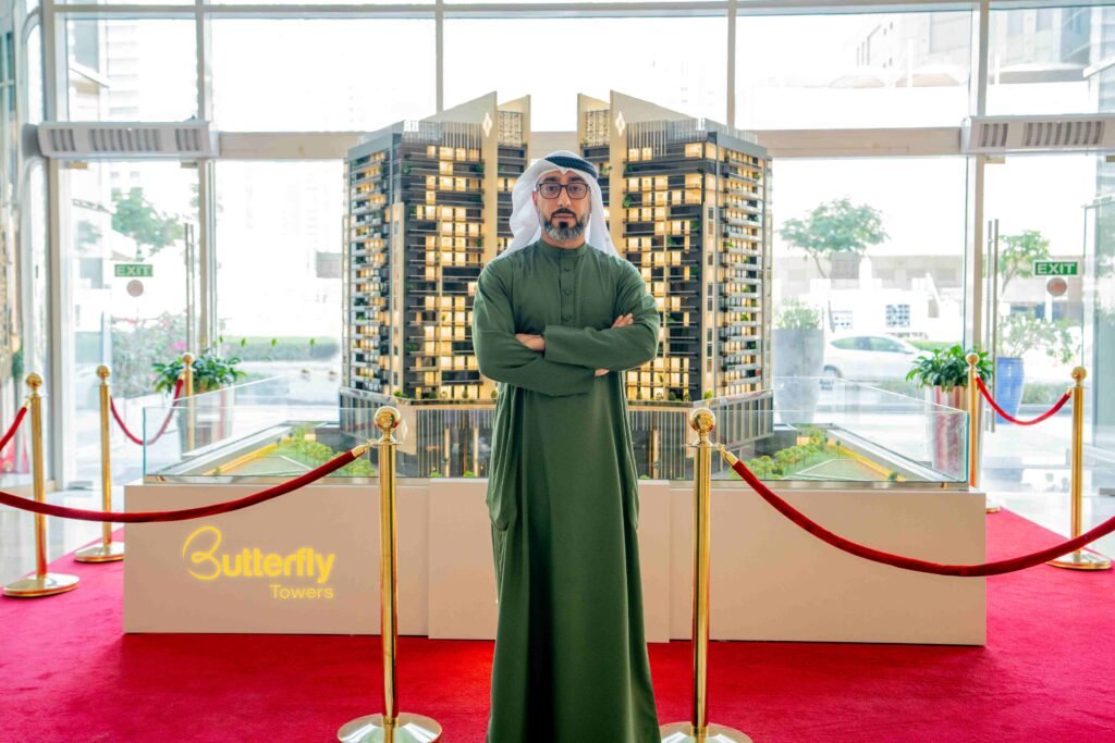Marwan Al Sayyah, CEO of Al Sayyah Group, showcasing a model of the Butterfly Towers