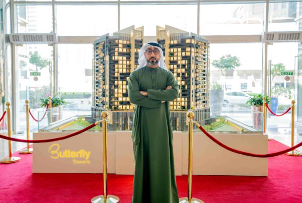 Marwan Al Sayyah, CEO of Al Sayyah Group, showcasing a model of the Butterfly Towers